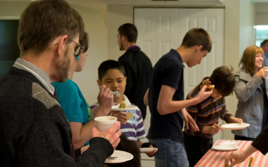 Church family sharing a fellowship meal