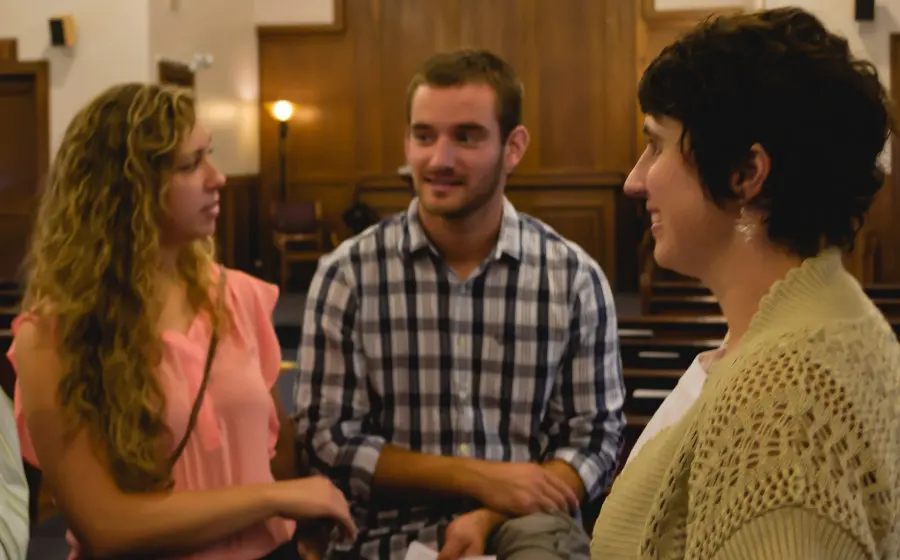Friends talking in the sanctuary after worship