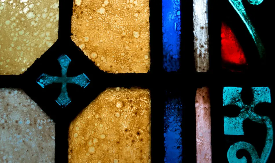 Stained glass window with a cross