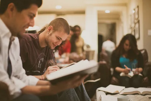 Members of the congregation studying the Bible together